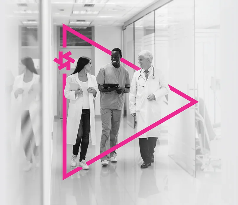 Black and white photo of three healthcare professionals smiling with a pink Propelus logo overlaid